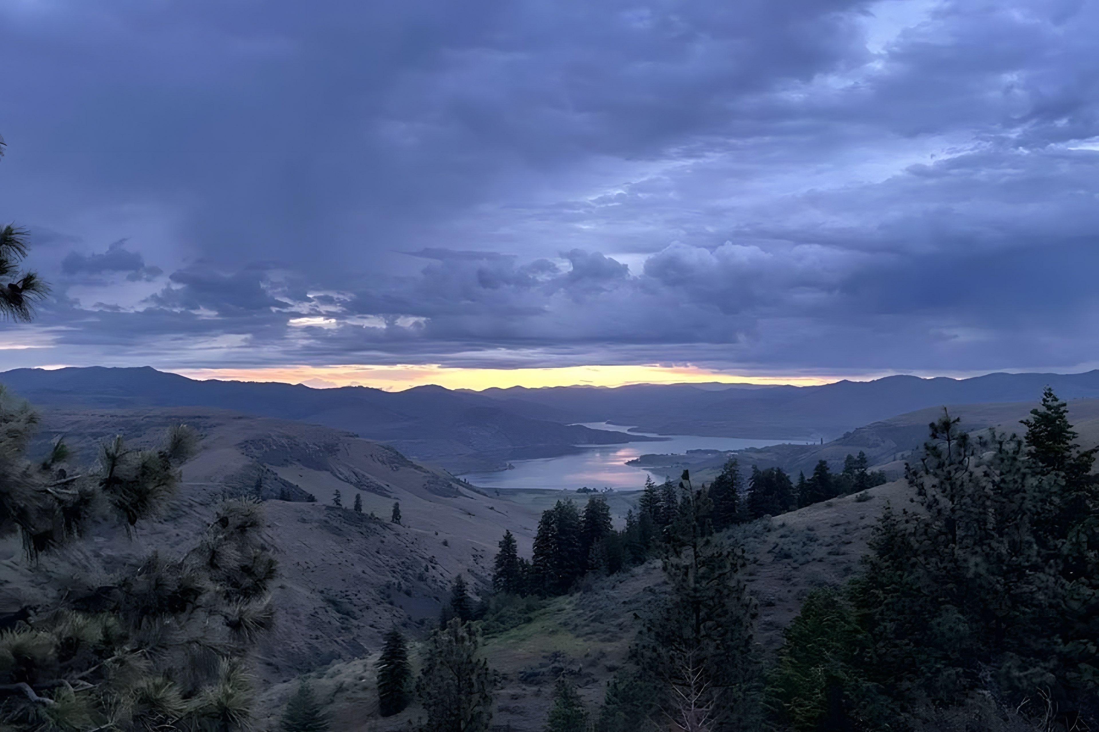 Sunset over Lake Roosevelt and the hills above the park